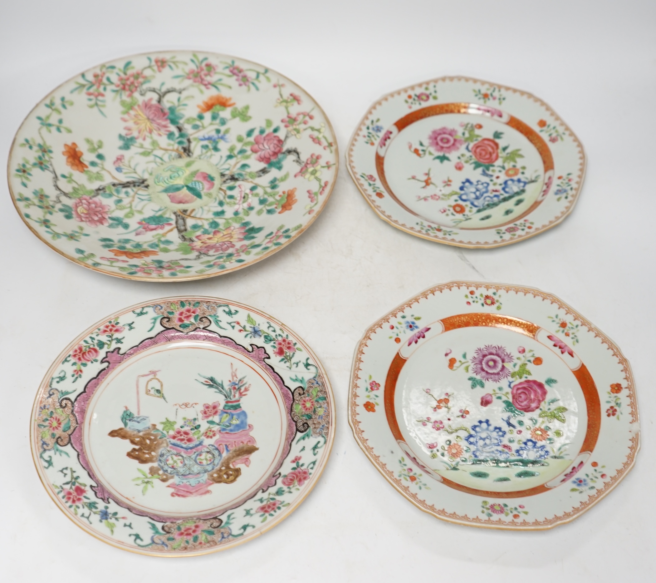 A pair of Chinese famille rose octagonal dishes, one other similar and a Cantonese dish, 18th/19th century, largest 29.5cm (4). Condition - circular famille rose dish with a restored area